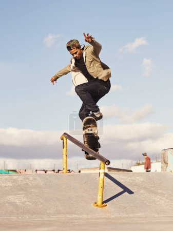 Photo for Energy, fitness and man with skateboard, jump or rail balance at a skate park for stunt training. Freedom, adrenaline and gen z male skater with air, sports or skill practice, exercise or performance. - Royalty Free Image