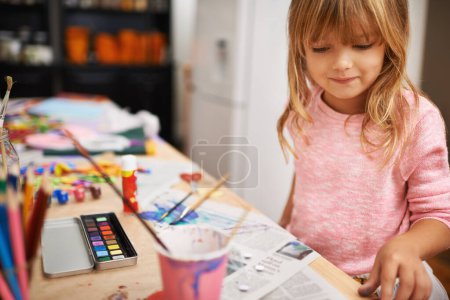 Photo for Happy girl, paint and drawing with color for creativity, learning or education at home. Young child with smile and paintbrush for sketching, writing or artwork on table in happiness at the house. - Royalty Free Image