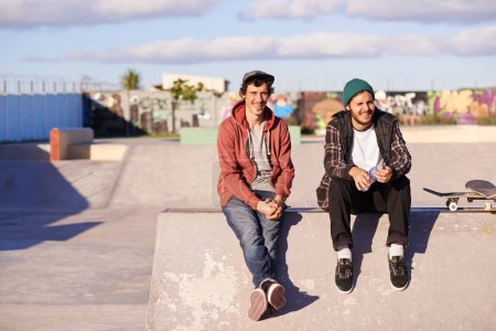 Skate park, portrait and skater friends relax outdoor after fun session, training or bonding on vacation. Skateboard, hobby and gen z male people chilling on a ramp for break, holiday or boarding.