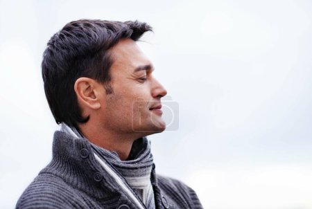 Photo for Cloud sky, thinking and man with peace, ideas and wellness with stress relief and freedom. Person, outdoor and guy with confidence and happiness with choice and wonder with thoughts and carefree. - Royalty Free Image