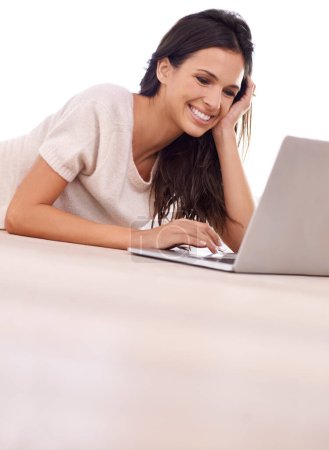 Photo for Face, relax and laptop with woman on floor of living room in home for email, internet or research. Computer, smile and social media with happy young person in apartment for website browsing. - Royalty Free Image