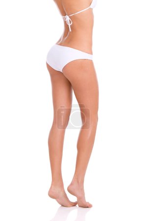 Photo for Legs, woman in underwear and epilation for skincare, beauty and grooming isolated on white background. Smooth skin, wellness with cosmetics and shine from waxing or laser hair removal in studio. - Royalty Free Image
