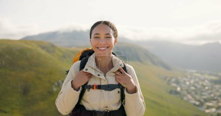 Photo for Happy woman, face and backpack with mountain for hiking, adventure or outdoor journey in nature. Portrait of female person, tourist or hiker smile with bag for trekking or climbing on cliff or hills. - Royalty Free Image