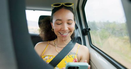 Photo for Woman, phone and texting on road trip, car or laugh at meme, comic video and internet for travel. Girl, smartphone and reading in vehicle with funny blog, social network post or story with transport. - Royalty Free Image