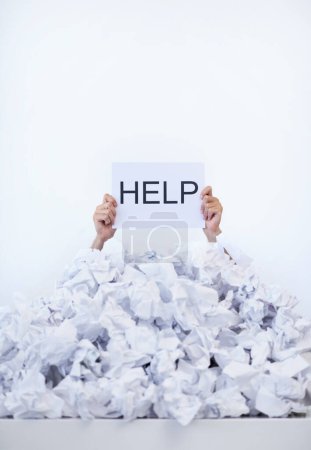 Photo for Person, desk and hands with pile of paperwork, sign and help with burnout, stress and administration. Debt, bills and worker lost in documents, overworked and overwhelmed with pressure in office - Royalty Free Image