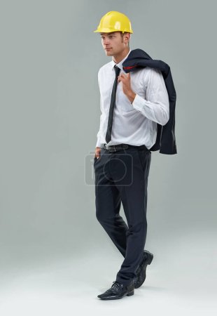Photo for Man, engineer and thinking in studio for project for architect industry, maintenance or hard hat. Male person, thoughts and labor employee on grey background or construction, jacket or mockup space. - Royalty Free Image