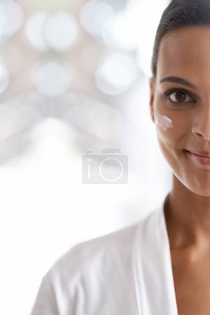 Photo for Portrait, skincare and closeup of woman with lotion for dermatology, wellness or beauty in morning. Smile, moisturizer and face of person for cosmetics facial treatment and healthy skin in house - Royalty Free Image