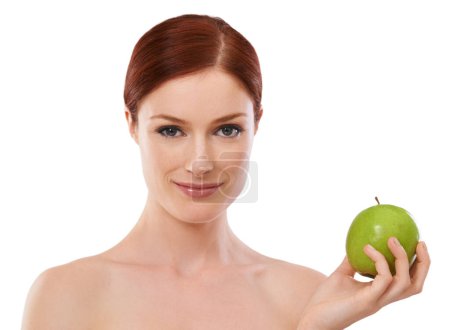 Photo for Portrait, wellness and woman with apple in studio with smile in white background for healthcare. Female person, happiness and joy fruit as food for vitamins to eat in diet, nutrition and natural. - Royalty Free Image