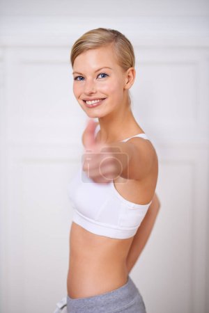 Photo for Happy woman, portrait and fitness with thumbs up for workout, exercise or training at home. Face of female person or yogi with smile, like emoji or yes sign for good job, success or winning at house. - Royalty Free Image