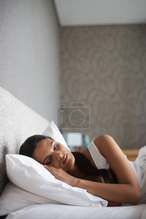 Photo for Woman, sleeping and bed for rest, dream and wellness as stress relief in bedroom in Rio de Janeiro. Mental health, female person and eyes closed on pillow for calm, peace and relax for self care. - Royalty Free Image