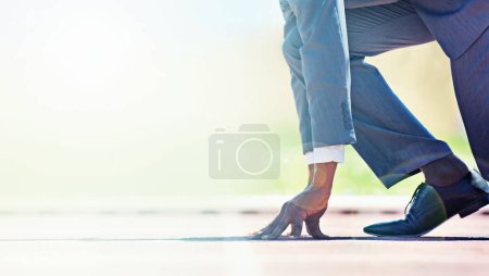 Photo for Run towards your business goals. A young businessman at the starting line of a race track - Royalty Free Image