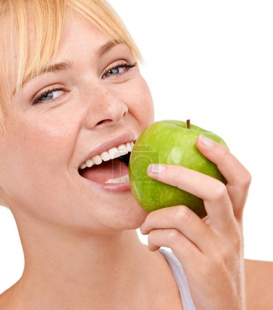 Photo for Portrait, nutrition and happy woman with apple for diet, benefits or food to lose weight in studio. Healthy eating, smile and face of girl with fruit for body wellness, digestion and white background. - Royalty Free Image