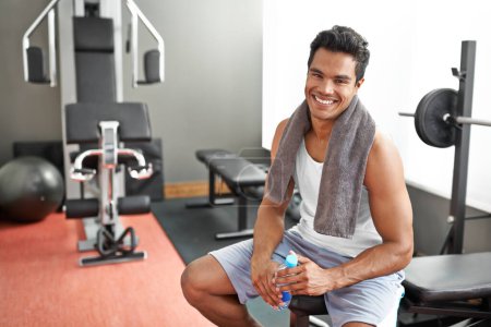 Photo for Gym, portrait and happy man with water bottle for recovery after exercise and body building. Healthy, fitness and person relax after workout with liquid hydration for benefits to muscle and wellness. - Royalty Free Image