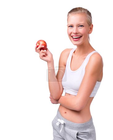Photo for Smile, woman and apple in studio, wellness and clean food for balance diet. Slimming and health eating habit with fruit and vitamin for nutrition and fibre for digestion, model on white background. - Royalty Free Image
