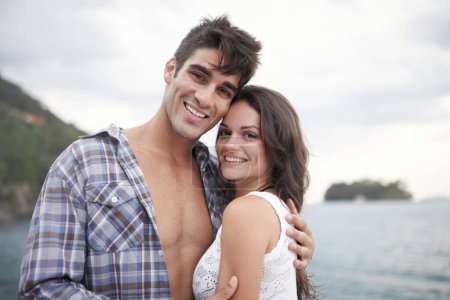 Photo for Portrait, smile and couple at ocean on vacation, holiday or travel together outdoor in Italy. Face, man and happy woman at sea for adventure, care and connection in summer by beach in nature for love. - Royalty Free Image