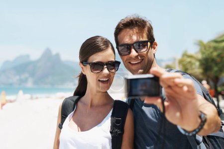 Photo for Couple, beach and camera for selfie on holiday with smile, sunglasses and outdoor for memory in summer. People, man and woman with photography by ocean for journey, vacation and sunshine in Italy. - Royalty Free Image