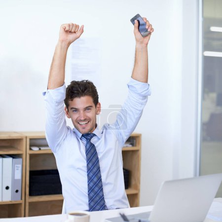 Photo for Businessman, portrait and celebration for good news or achievement or opportunity, deal or promotion. Male person, face and arms up at laptop as financial consultant or win, congratulations or target. - Royalty Free Image