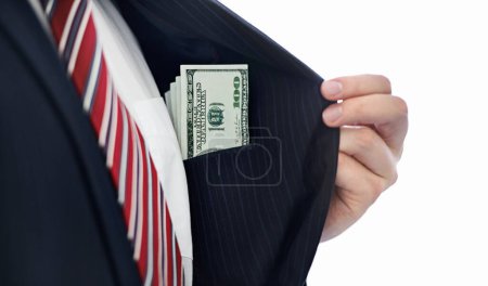 Photo for Business man, cash and suit pocket with corruption, bribe or secret deal for money laundering in studio. Hands, person and payment in jacket for corporate crime with illegal profit, banking or fraud. - Royalty Free Image