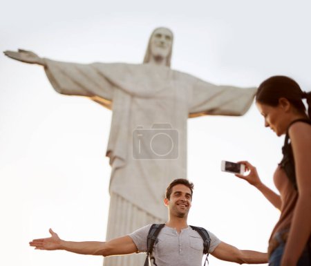 Photo for Tourist, happy and photograph with monument for sightseeing, freedom and christ the redeemer statue in Rio de Janeiro with girlfriend. Couple, explore and holiday for adventure or tour with cellphone. - Royalty Free Image