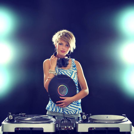 Photo for Portrait, concert and woman dj with mixer on dark background for entertainment at club, disco or party. Music, dance or performance with light for performance and disc jockey mixing audio or sound. - Royalty Free Image