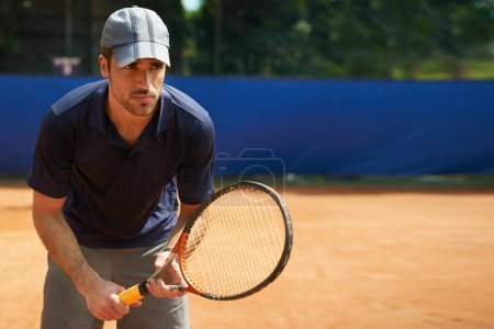 Photo for Athlete, man and racket in tennis court for training, fitness and sports for competition or hobby. Male person, sportswear and workout for game or health, wellness and wellbeing in summer or outdoor. - Royalty Free Image