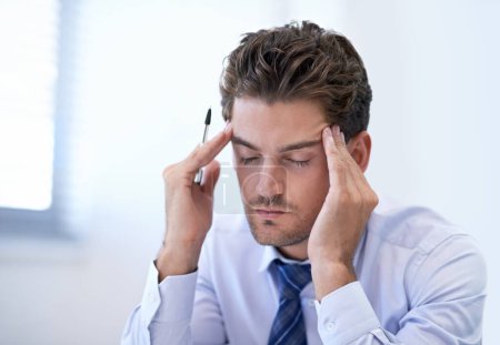 Photo for Headache, stress and business man with burnout, pain and anxiety for overwork in office. Migraine, depression and professional massage temples for fatigue, sick and tired agent frustrated in company. - Royalty Free Image