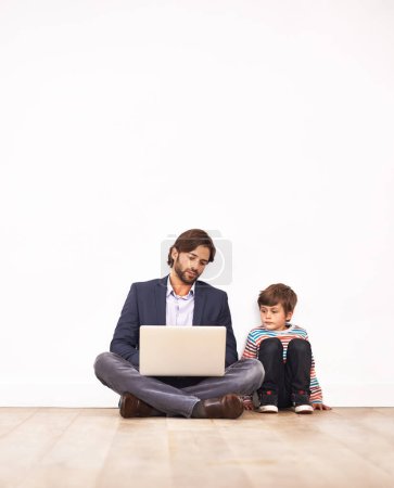 Photo for Businessman, son and relax on floor with laptop for remote work with video streaming, online games or movies in home. Family, father or kid with technology on ground for bonding, communication or fun. - Royalty Free Image