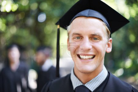Photo for Graduation, man and portrait for student, celebration and college with cap and gown in outdoor background. University male person, happy and campus for school, class and confidence in education. - Royalty Free Image