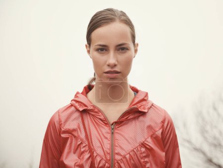 Photo for Woman, portrait and fitness outdoor with fog for hiking, exercise and workout in nature with confidence. Athlete, person and face with pride for running, training and sportswear for healthy body. - Royalty Free Image