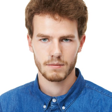 Photo for Serious, man and portrait for fashion, denim shirt and clothing in casual blouse on white background with closeup, stylish and frowning. Male person, model or stern face in studio in England. - Royalty Free Image