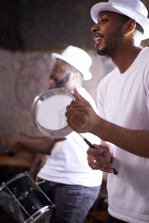 Photo for Music, concert and man with tambourine, percussion instruments and band mate on stage in Sao Paulo. Happy black men, drummer and musician for playing, singing and dancing in night club performance. - Royalty Free Image