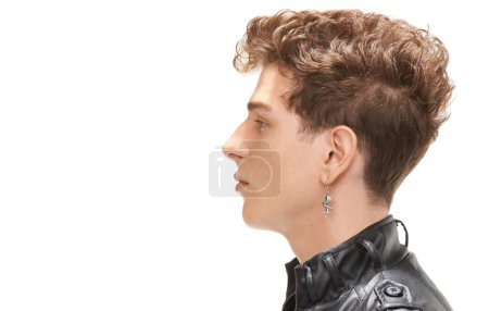 Photo for Studio, profile and man with leather jacket for fashion, gen z and aesthetic in white background. Male person, cool and serious with trendy hairstyle, stylish and closeup of face, guy and model. - Royalty Free Image