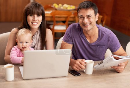 Photo for Family, portrait and laptop in kitchen with coffee in morning for remote work, freelancing and planning. Mom, dad and child in home at table with computer for internet, online for streaming for ideas. - Royalty Free Image