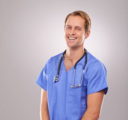 Photo for Man, nurse and portrait in studio, healthcare expert and specialist on gray background. Happy male person, cardiologist and proud of career on mockup space, trustworthy physician and medicare health. - Royalty Free Image