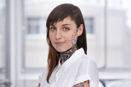 Photo for Business, woman and tattoo with portrait in office with confident attitude, serious and pride with mockup space. Entrepreneur, face of artist and designer with ink skin, body art and grunge aesthetic. - Royalty Free Image