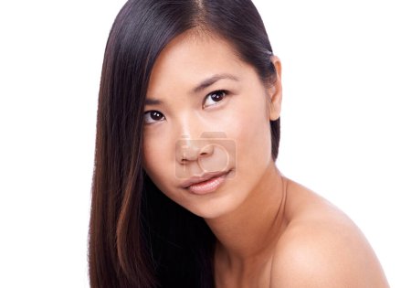 Photo for Asian woman, thinking and white background with hair or skin for beauty, model and cosmetics for skincare or routine. Wellness, closeup and natural or healthy face with dermatology isolated in studio. - Royalty Free Image