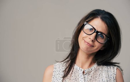 Photo for Glasses, fashion and portrait of woman on gray background for vision, eyesight and optometry. Optician, mockup space and face of isolated person with spectacles, prescription lens and frame in studio. - Royalty Free Image