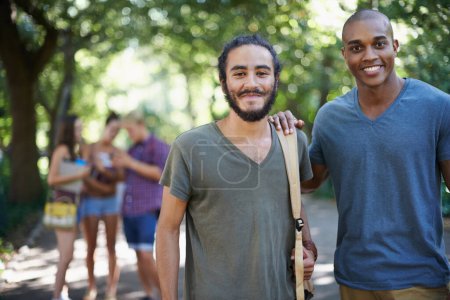 Photo for Students, friends and portrait on campus for learning, knowledge and education with support at college. Happy young men or people in diversity for study, opportunity and outdoor at park or university. - Royalty Free Image