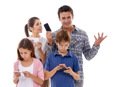 Photo for Family, phone and online in studio with internet for text message, email conversation and video streaming. Father, mother and children with smartphone, technology and mobile chat on white background. - Royalty Free Image