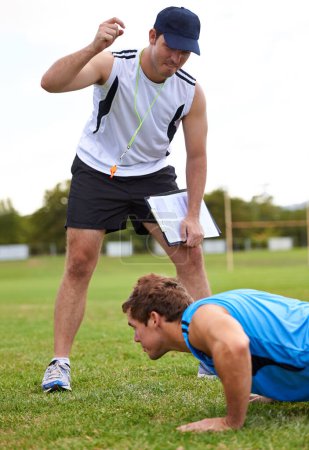 Photo for Men, push up and personal trainer on grass for fitness with clipboard for stats, progress or development. Person, coach or mentor with motivation for results, training or workout for health on field. - Royalty Free Image