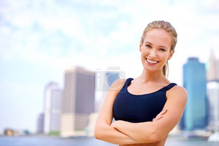 Photo for Exercise, portrait and woman with arms crossed for health, morning workout or running competition in city. Smile, wellness and face of female person for cardio, fitness and confidence in New York. - Royalty Free Image