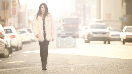 Photo for Woman, fashion and portrait for walk, city or travel outdoor with coat and fur for winter and urban. Young person with jacket for style, luxury and aesthetic for trend and trip for warm and rich. - Royalty Free Image