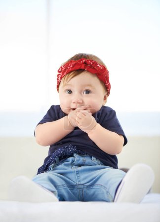 Photo for Portrait, sitting and bed for baby fashion in family home, cute and trendy street style on curious girl toddler. Creative, child development and growth, adorable headband accessory with funky clothes. - Royalty Free Image