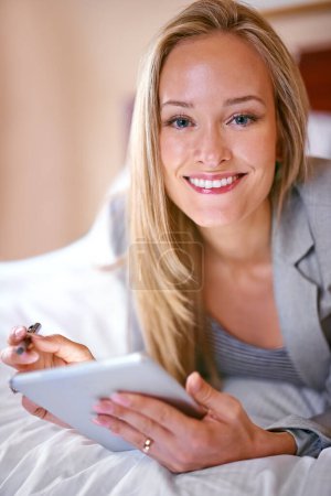 Photo for Business, woman and tablet on bed with portrait for corporate planning, digital technology and work research. Professional, person and touchscreen for writing review notes or internet search in hotel. - Royalty Free Image