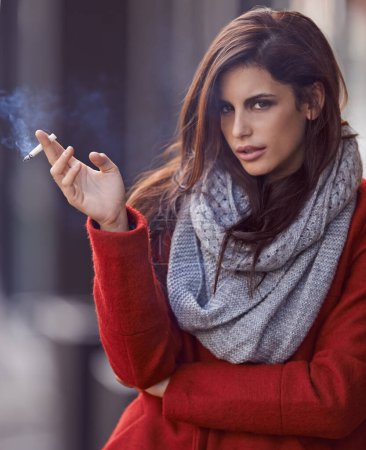 Photo for Portrait, winter and woman with a cigarette, outdoor and cold weather with a bad habit in New York city. Face, person and girl smoking, fashion and casual outfit with season and tobacco with style. - Royalty Free Image
