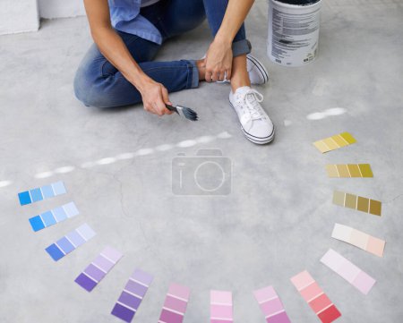 Feet, paint swatch and color for renovation in home, remodeling and maintenance in apartment. Person, floor and choice or decision for interior upgrade, diy and brush for house repairs or project.