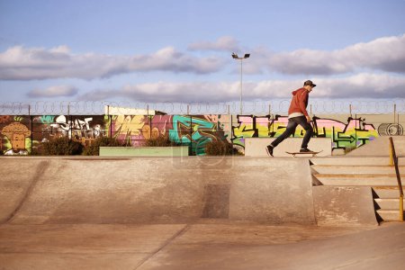 Photo for Man, skateboard and ramp in skatepark for summer, skate and recreation for fun and active for game or holiday. Young person and performing, trick and sports for wheel, move and action on mockup. - Royalty Free Image