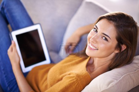 Photo for Woman, portrait and relax on couch with tablet for internet browsing or social media, online shopping and website. Female person, digital technology and sofa to lounge with connectivity and peaceful - Royalty Free Image