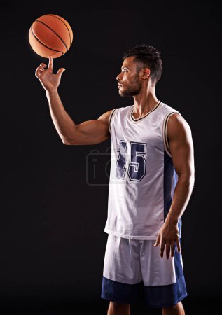 Photo for Man, finger and basketball player in studio as sports athlete for workout competition, training or black background. Male person, ball and exercise champion or professional, fitness or mockup space. - Royalty Free Image