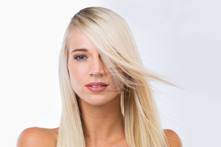 Photo for Blonde woman, long hair and studio portrait with smile, wellness or results for beauty by white background. Girl, person and model for hairstyle, transformation or change with natural glow for health. - Royalty Free Image